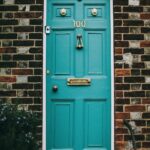 teal wooden panel door