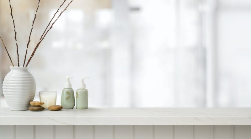 shelf in bathroom with vase and toiletries