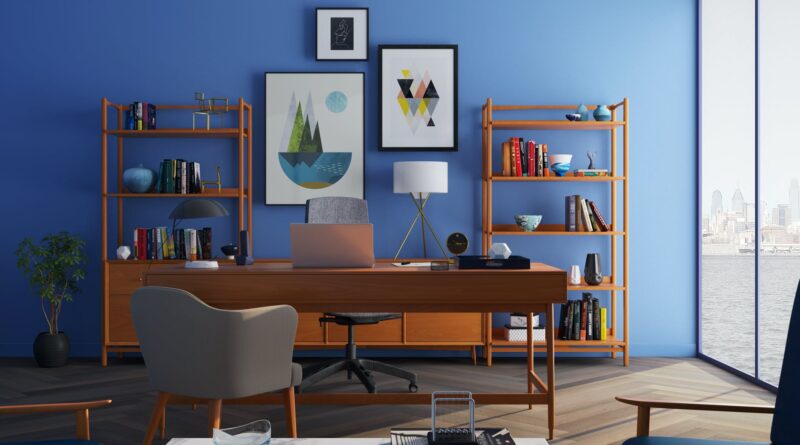 brown wooden desk with rolling chair and shelves near window