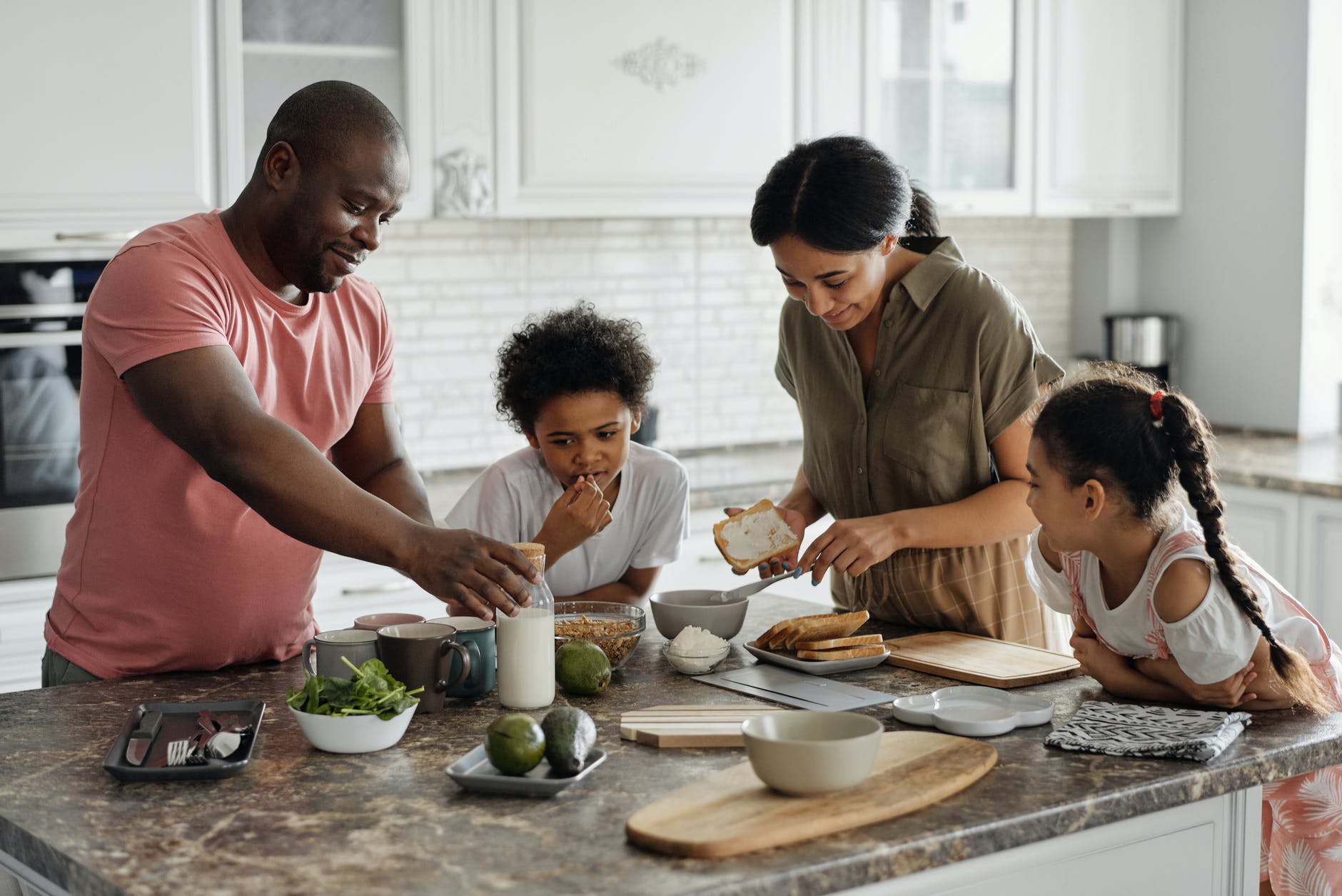 family in the kitchen - home cleaning tips