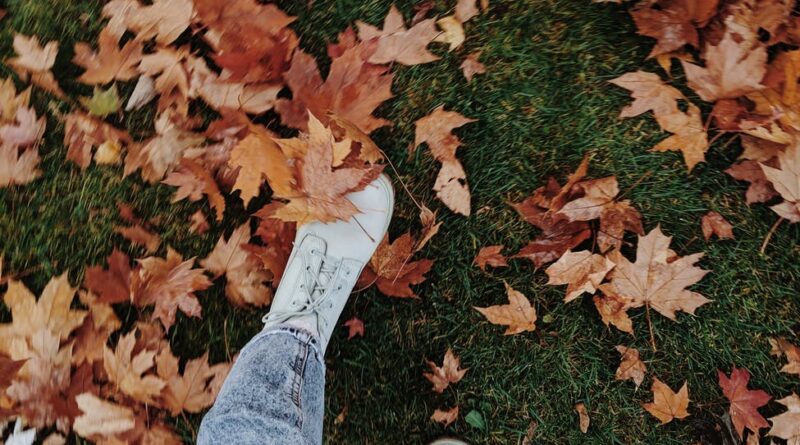 high angle photo of person wearing shoes